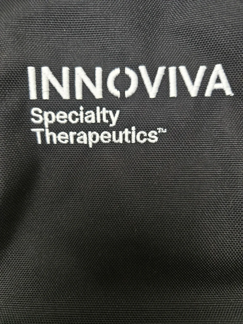 Thule Black Backpack with Innoviva Specialty Therapeutics Logo